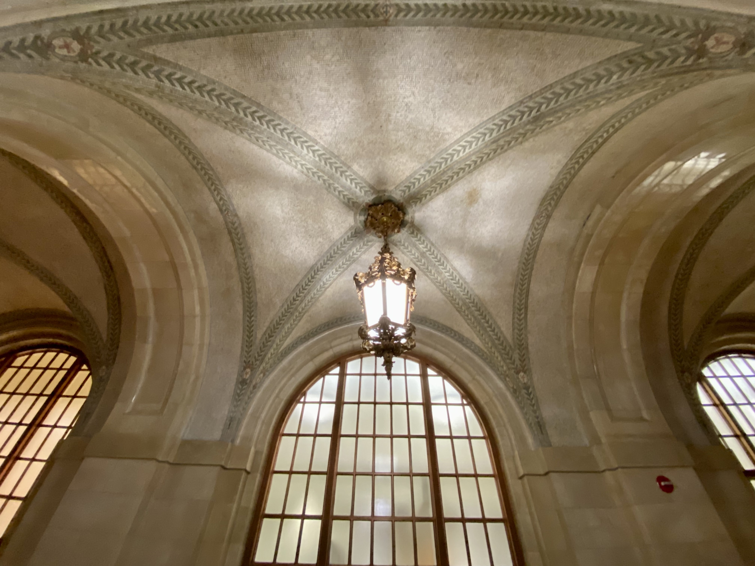 Close up on arhictectural features of the space detailing the tile work in the arched ceilings.